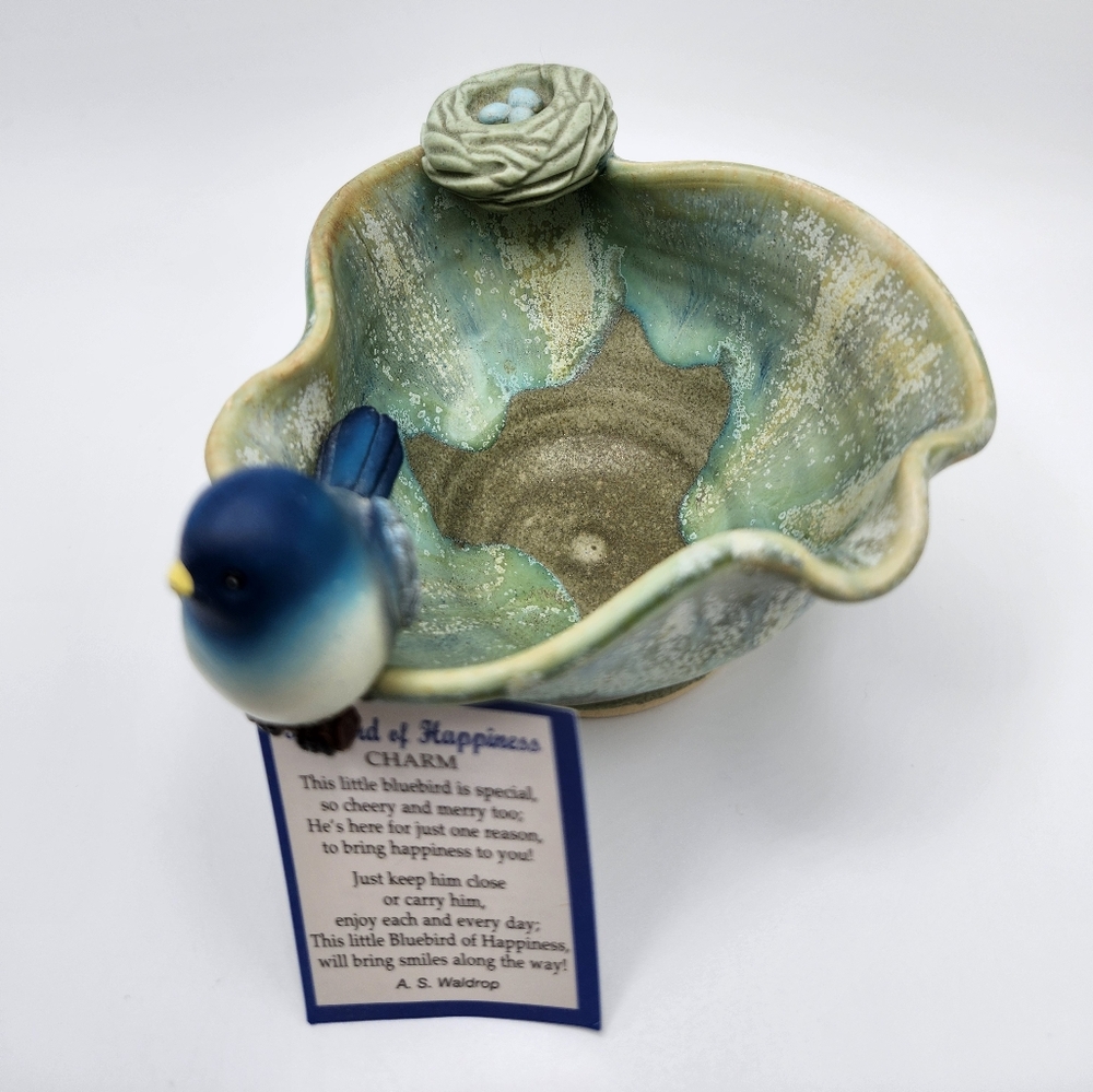 An adorable small artisan made pottery bowl with nest & eggs. Bluebird happiness